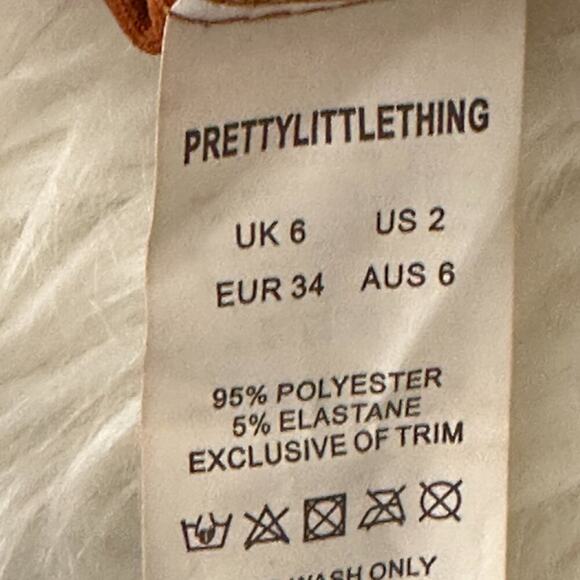 NWT PrettyLittleThing Burnt Orange Tassel Hem Mini Skirt Womens 2 Boho Western - Picture 8 of 8